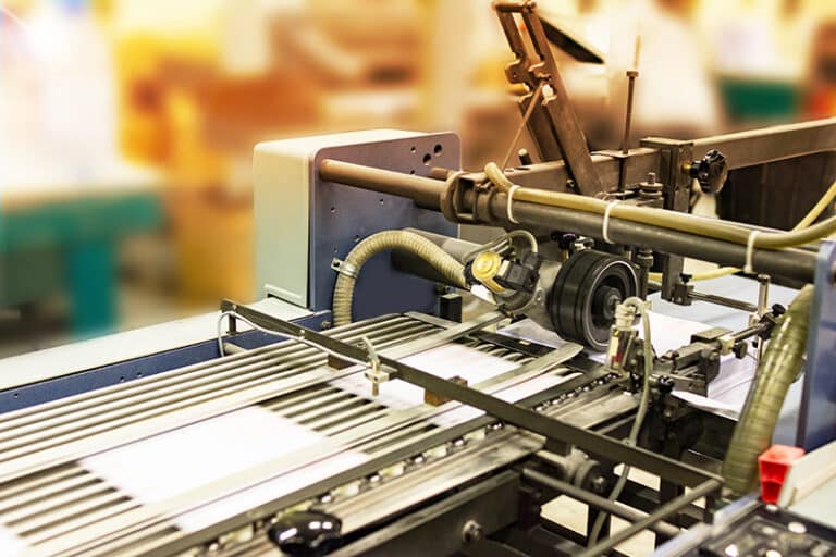 Folding documents for a mailing in a press